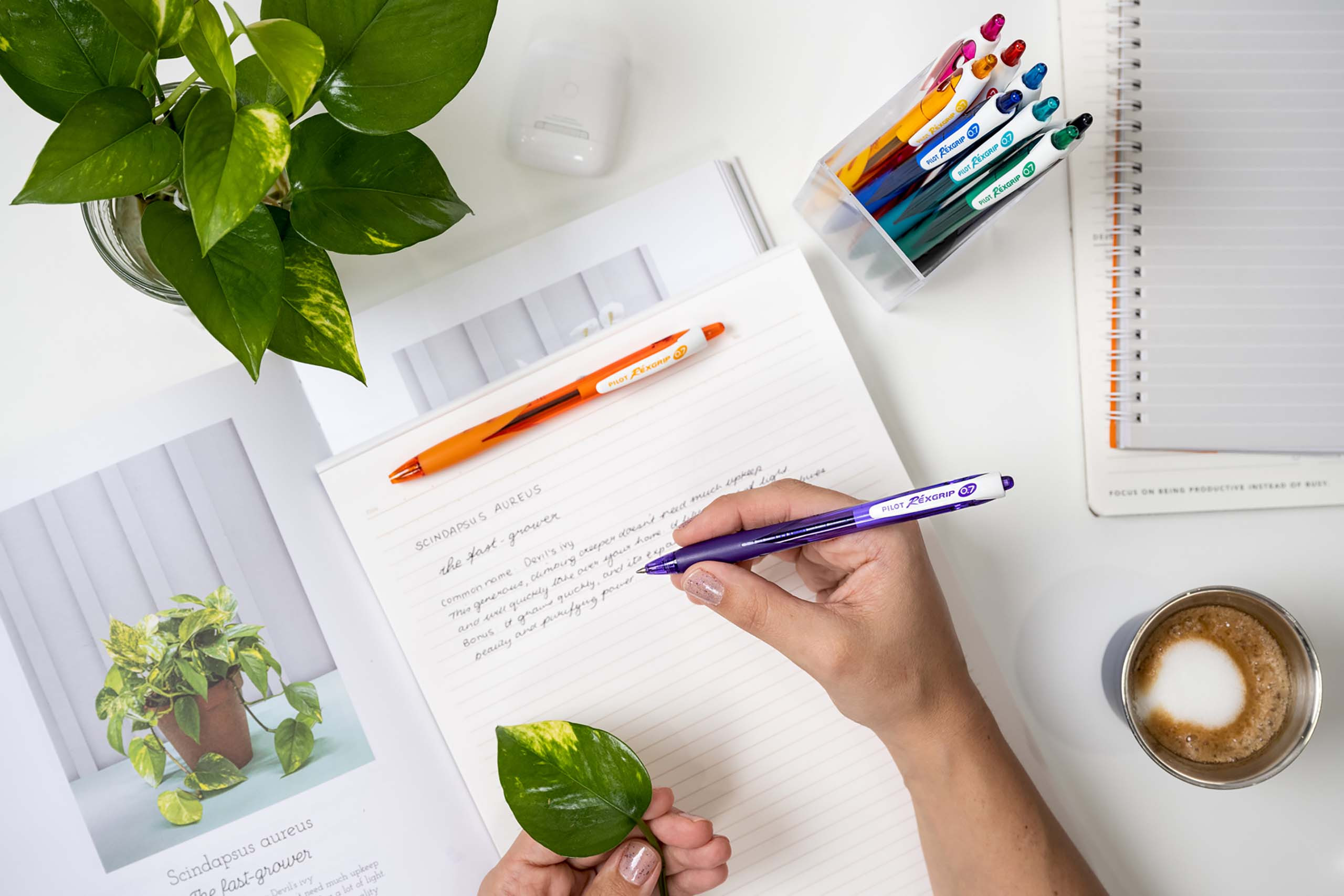 A student writing with a Rexgrip Retractable Ballpoint Pen, highlighting the superior comfortable grip needed for long periods of note-taking.