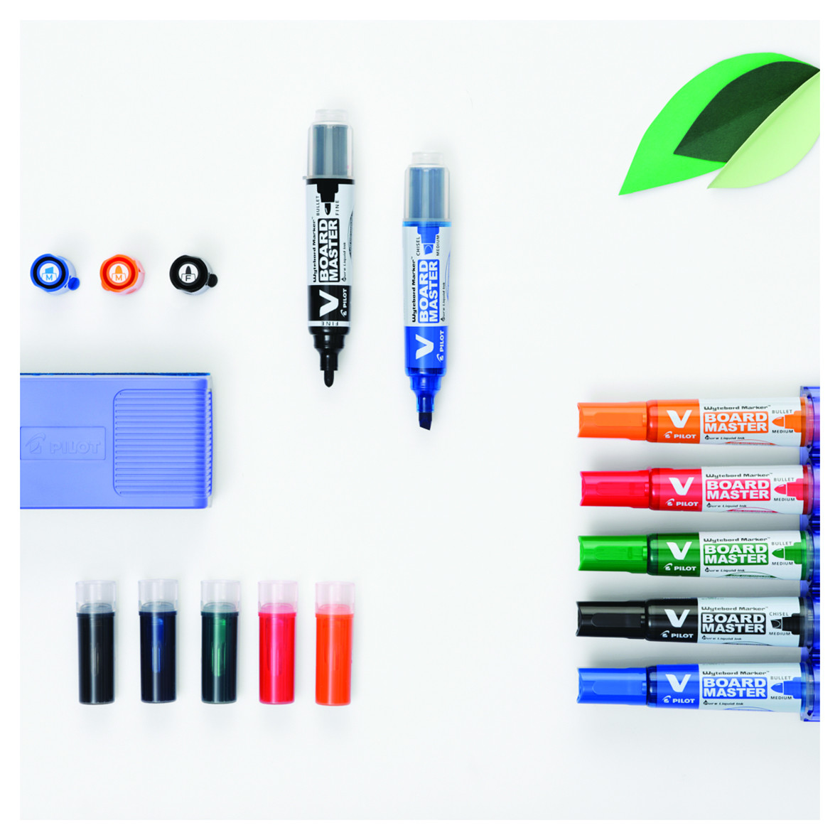 Pilot V Board Master refillable markers in a blue holder on a whiteboard, perfect for professionals and teachers seeking sustainability.